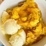 You'll love this Crock Pot Peach Cobbler because it's only 3 simple ingredients, it's the perfect dessert for any occasion, and it's a cinch to put together. This crock pot peach cobbler is my go-to dessert for a potluck for family gathering when I'm short on time. It's only 3 ingredients! The ingredients are peach pie filling, yellow cake mix, and butter. That's it! It takes literally 5 minutes to prep, it's inexpensive to make and it feeds a lot of people.