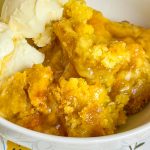 You'll love this Crock Pot Peach Cobbler because it's only 3 simple ingredients, it's the perfect dessert for any occasion, and it's a cinch to put together. This crock pot peach cobbler is my go-to dessert for a potluck for family gathering when I'm short on time. It's only 3 ingredients! The ingredients are peach pie filling, yellow cake mix, and butter. That's it! It takes literally 5 minutes to prep, it's inexpensive to make and it feeds a lot of people.