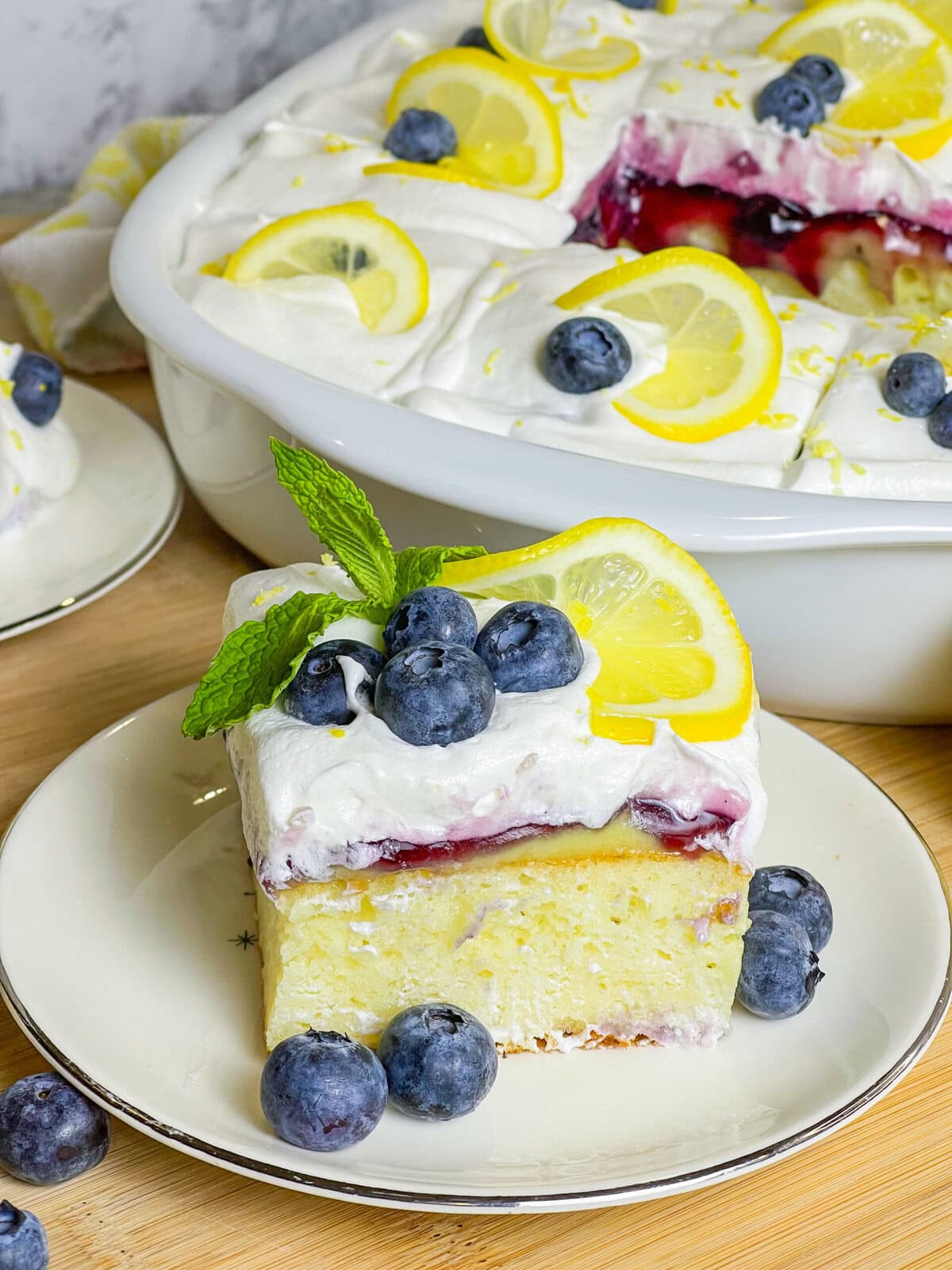 This Blueberry Lemon Poke Cake is a bright and refreshing dessert that’s as beautiful as it is delicious! It starts with a soft and fluffy white cake, infused with tangy lemon pudding that soaks into every bite, adding a burst of citrus flavor. A luscious layer of blueberry pie filling follows, bringing just the right balance of sweetness and fruitiness. Finally, it’s topped with a light and creamy whipped topping, making every forkful a dreamy combination of flavors and textures. Perfect for spring, summer, or anytime you’re craving a dessert that’s equal parts sweet, zesty, and irresistibly moist!