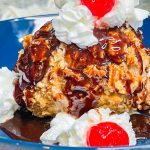 Air Fryer Fried Ice Cream is such a treat and easier to make than you might think. It's vanilla ice cream coated in cinnamon sugar cereal and air fried so the inside is cool and creamy and the outside is crisp and crunchy. Top it with chocolate sauce and whipped cream and you have a dessert that is out of this world!