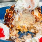 Air Fryer Fried Ice Cream is such a treat and easier to make than you might think. It's vanilla ice cream coated in cinnamon sugar cereal and air fried so the inside is cool and creamy and the outside is crisp and crunchy. Top it with chocolate sauce and whipped cream and you have a dessert that is out of this world!