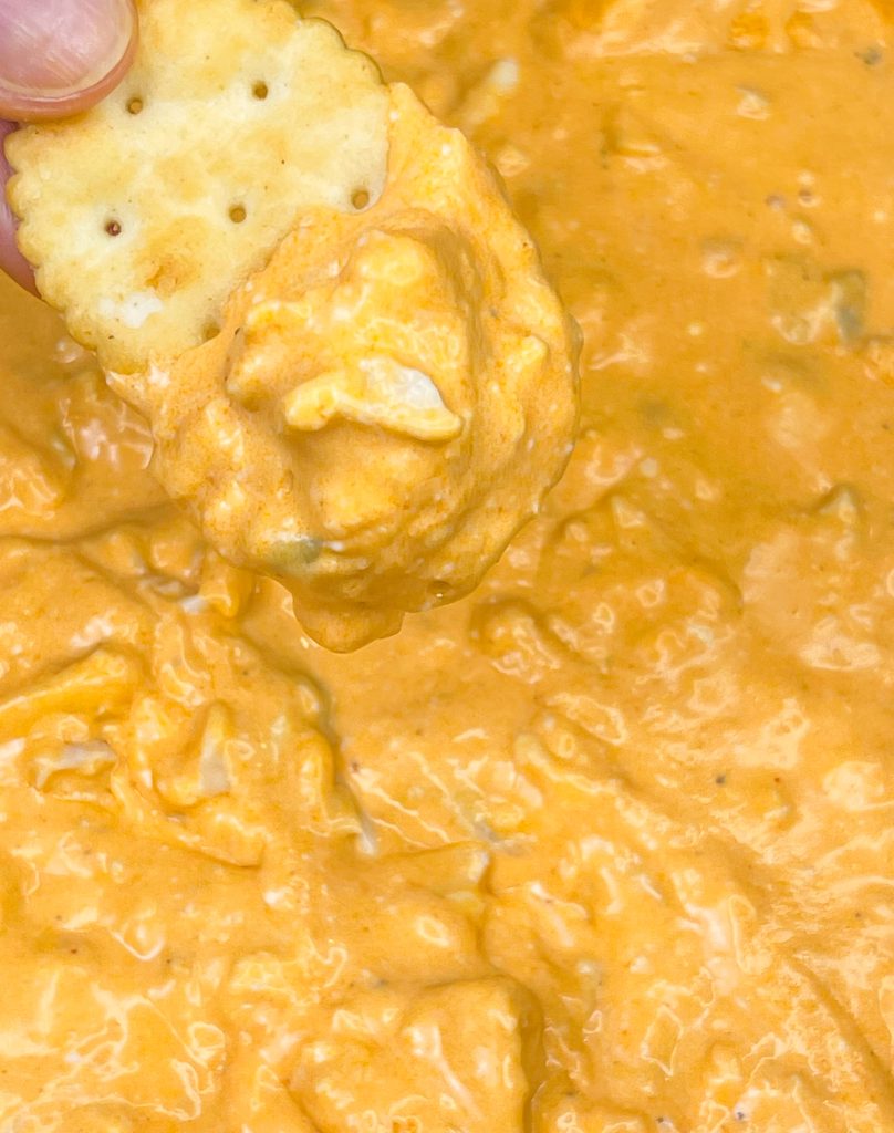 Crock Pot Buffalo Chicken Dip has all the flavors you love from buffalo wings but in a crowd friendly dip that's perfect to share for game day!