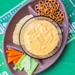 Crock Pot Buffalo Chicken Dip has all the flavors you love from buffalo wings but in a crowd friendly dip that's perfect to share for game day!