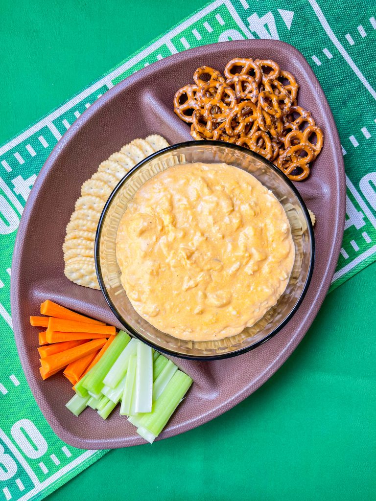 Crock Pot Buffalo Chicken Dip has all the flavors you love from buffalo wings but in a crowd friendly dip that's perfect to share for game day!