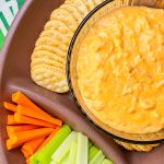 Crock Pot Buffalo Chicken Dip has all the flavors you love from buffalo wings but in a crowd friendly dip that's perfect to share for game day!