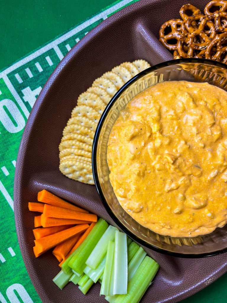 Crock Pot Buffalo Chicken Dip has all the flavors you love from buffalo wings but in a crowd friendly dip that's perfect to share for game day!