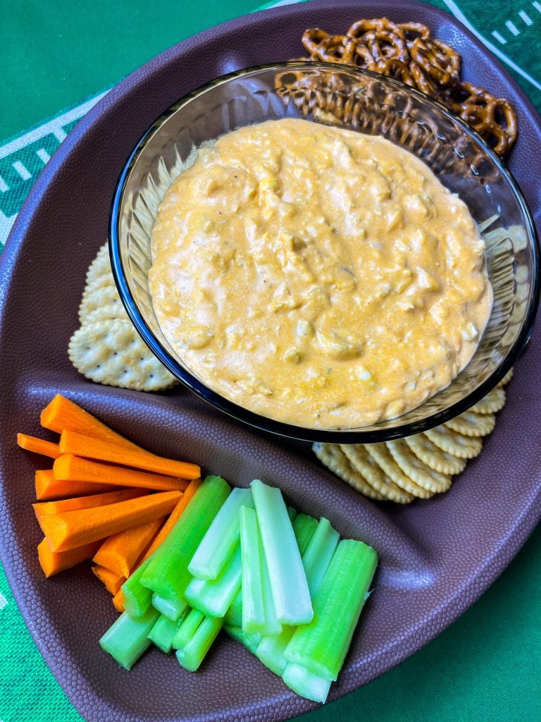 Crock Pot Buffalo Chicken Dip has all the flavors you love from buffalo wings but in a crowd friendly dip that's perfect to share for game day!