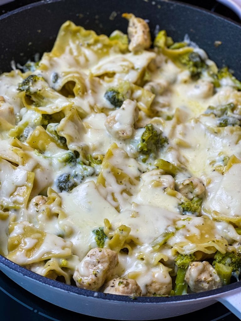 Chicken Broccoli Lasagna Skillet is a one pan dinner using chicken breast, frozen broccoli, heavy cream, chicken broth, and broken lasagna noodles. I always have a couple of noodles leftover when making lasagna and I never know what to do with them. Until now! This cheesy weeknight skillet dinner gets those random noodles out of your pantry and into a creamy, cheesy meal your family will love! If you don't have extra lasagna noodles, you can use any random noodles you have on hand.