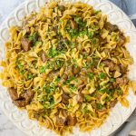 Crock Pot Beef and Noodles is a hearty and comforting dinner of stew meat and gravy served over egg noodles that's perfect for cool winter's nights.