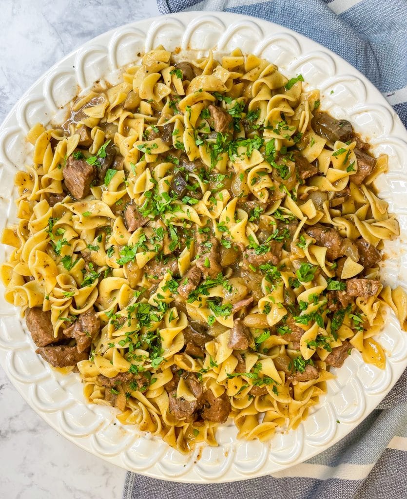 Crock Pot Beef and Noodles is a hearty and comforting dinner of stew meat and gravy served over egg noodles that's perfect for cool winter's nights.