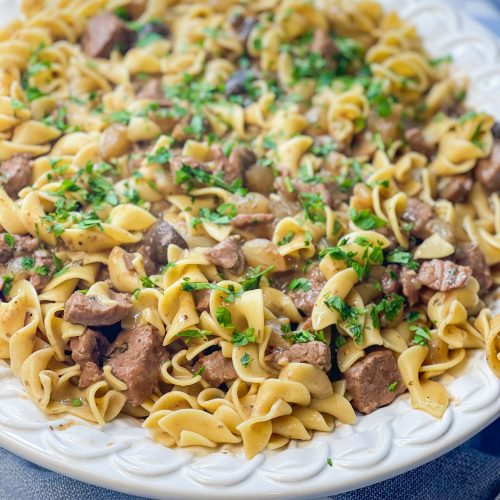 Crock Pot Beef and Noodles is a hearty and comforting dinner of stew meat and gravy served over egg noodles that's perfect for cool winter's nights.