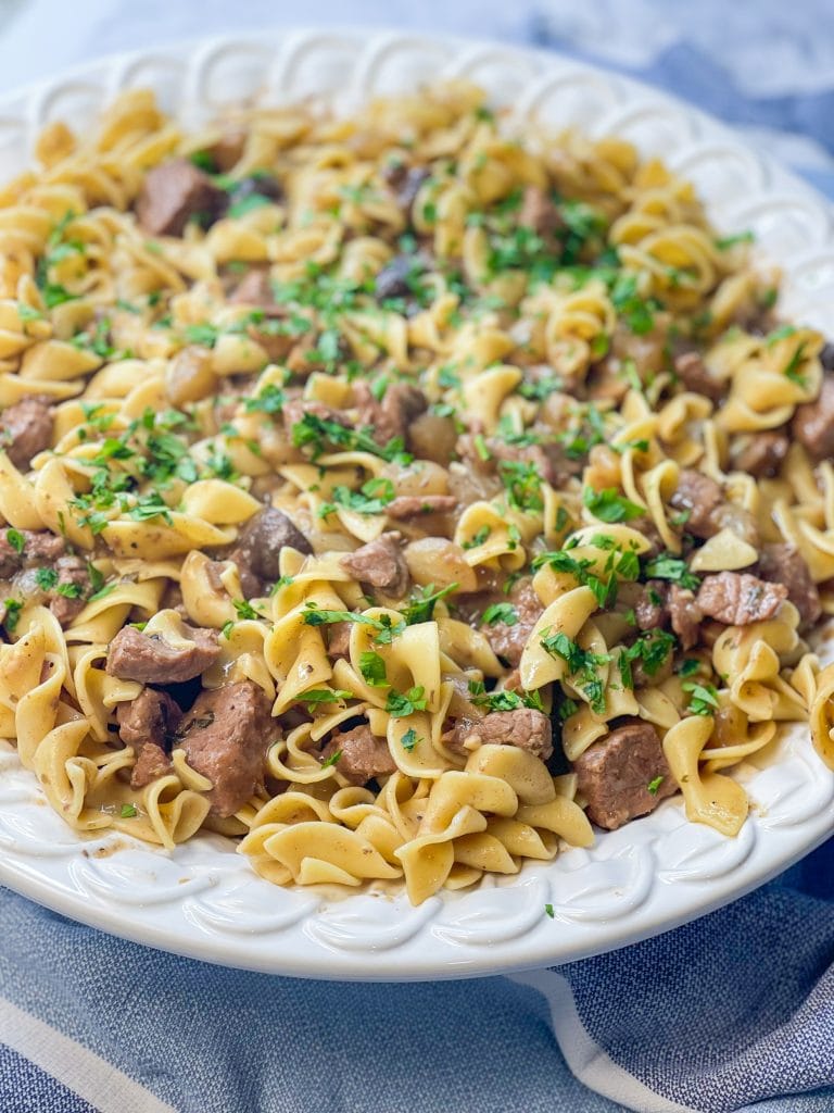 Crock Pot Beef and Noodles is a hearty and comforting dinner of stew meat and gravy served over egg noodles that's perfect for cool winter's nights.