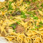 Crock Pot Beef and Noodles is a hearty and comforting dinner of stew meat and gravy served over egg noodles that's perfect for cool winter's nights.