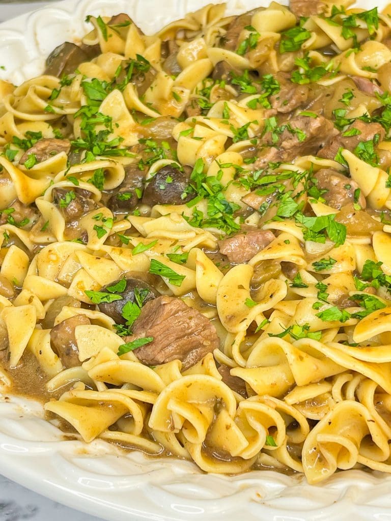 Crock Pot Beef and Noodles is a hearty and comforting dinner of stew meat and gravy served over egg noodles that's perfect for cool winter's nights.