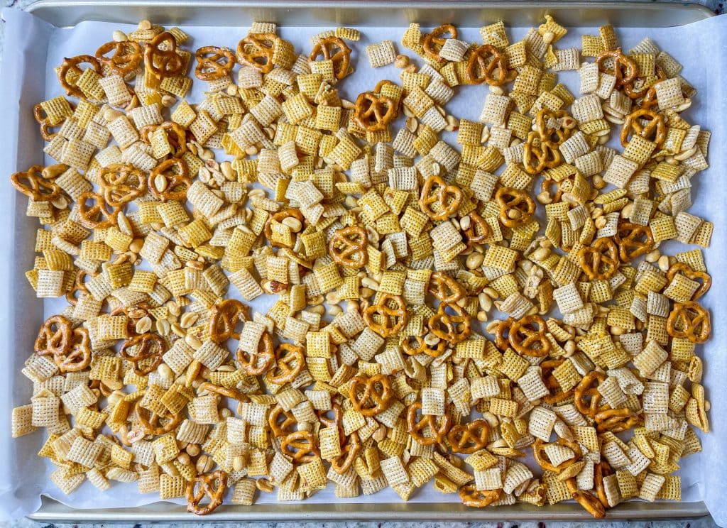 This sweet and salty Monster Mix is the perfect snack mix for the Halloween season. If you are a fan of a sweet and salty combo, then this snack mix is for you! It combines salty peanuts, pretzels and cereal with sweet M&Ms and candy corn in a brown sugar maple glaze. It's perfect for any Halloween or fall gathering.