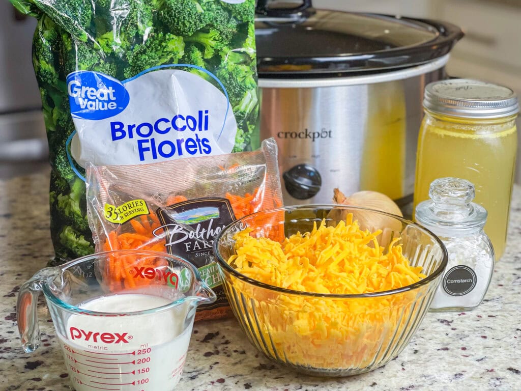 Crock Pot Broccoli Cheese Soup is creamy, comforting and familiar. It's a hugely popular soup made with broccoli, shredded carrots, cream, broth and sharp cheddar cheese.