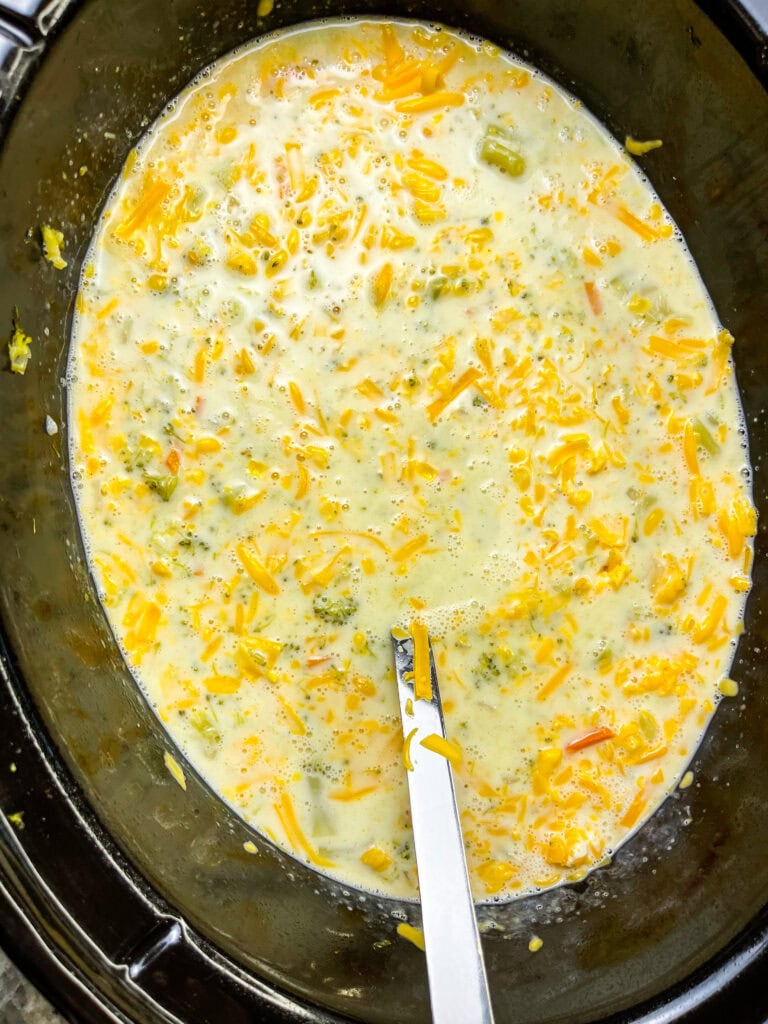 Crock Pot Broccoli Cheese Soup is creamy, comforting and familiar. It's a hugely popular soup made with broccoli, shredded carrots, cream, broth and sharp cheddar cheese.