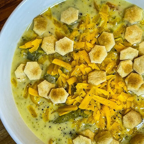 Crock Pot Broccoli Cheese Soup is creamy, comforting and familiar. It's a hugely popular soup made with broccoli, shredded carrots, cream, broth and sharp cheddar cheese.