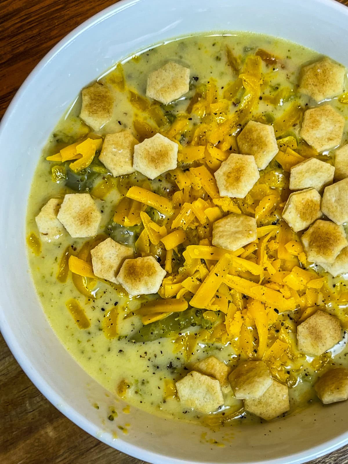 Crock Pot Broccoli Cheese Soup is creamy, comforting and familiar. It's a hugely popular soup made with broccoli, shredded carrots, cream, broth and sharp cheddar cheese.