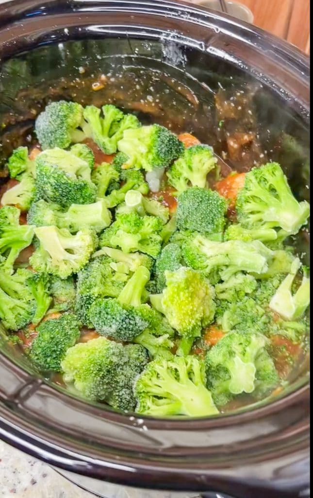 Craving Chinese inspired cuisine? Try this easy and simple Crock Pot Orange-y Chicken with broccoli. We love this served over a big bed of rice for a delicious dinner.