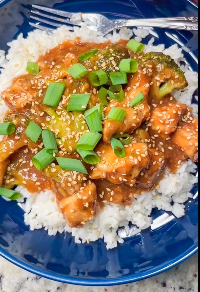 Craving Chinese inspired cuisine? Try this easy and simple Crock Pot Orange-y Chicken with broccoli. We love this served over a big bed of rice for a delicious dinner.