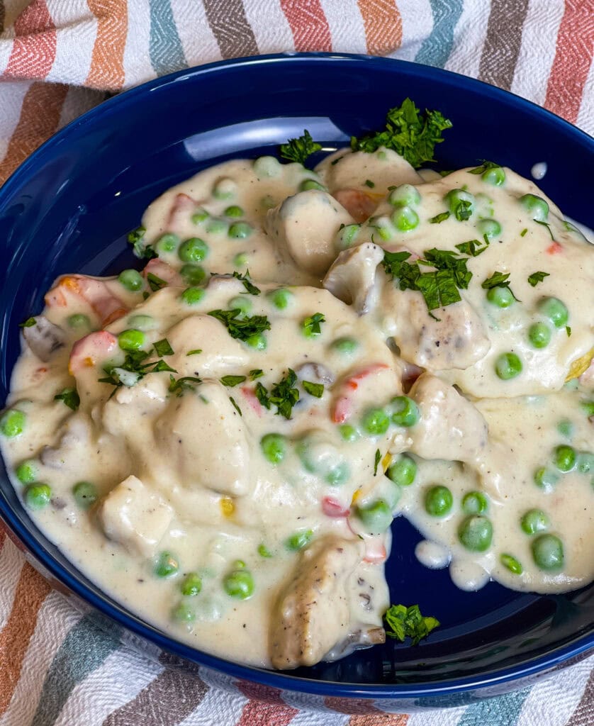 Juicy chicken breast in a creamy mushroom sauce with peas and pimentos, spooned over buttery biscuits; Chicken a La King is the ultimate comfort meal.