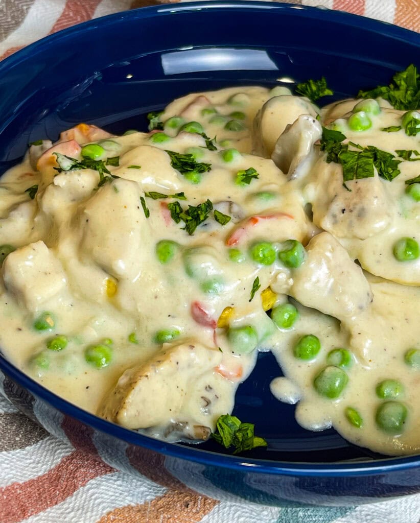 Juicy chicken breast in a creamy mushroom sauce with peas and pimentos, spooned over buttery biscuits; Chicken a La King is the ultimate comfort meal.