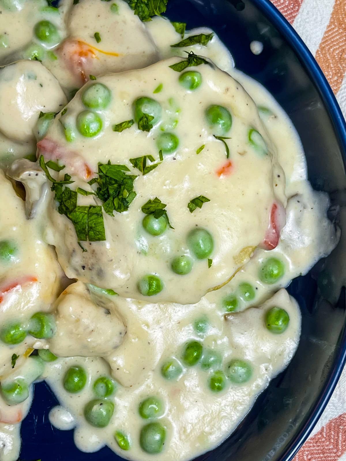 Juicy chicken breast in a creamy mushroom sauce with peas and pimentos, spooned over buttery biscuits; Chicken a La King is the ultimate comfort meal.