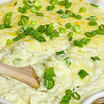 These Extra Cheesy Mashed Potatoes are just that- creamy, dreamy, fluffy and extra cheesy from a mix of sharp white cheddar and cream cheeses. A great side dish for any occasion or meal.