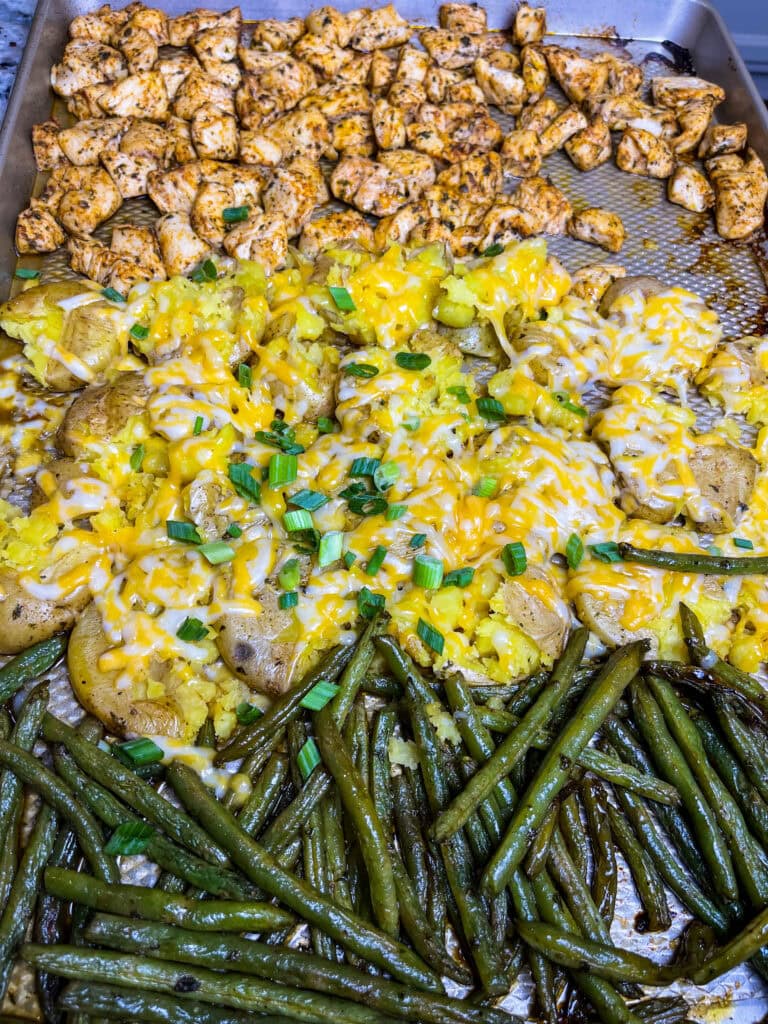 This easy Sheet Pan Ranch Chicken dinner is a weeknight lifesaver! Juicy chicken, tender baby potatoes, and crisp-tender green beans are tossed in flavorful ranch seasoning and roasted together on one pan.