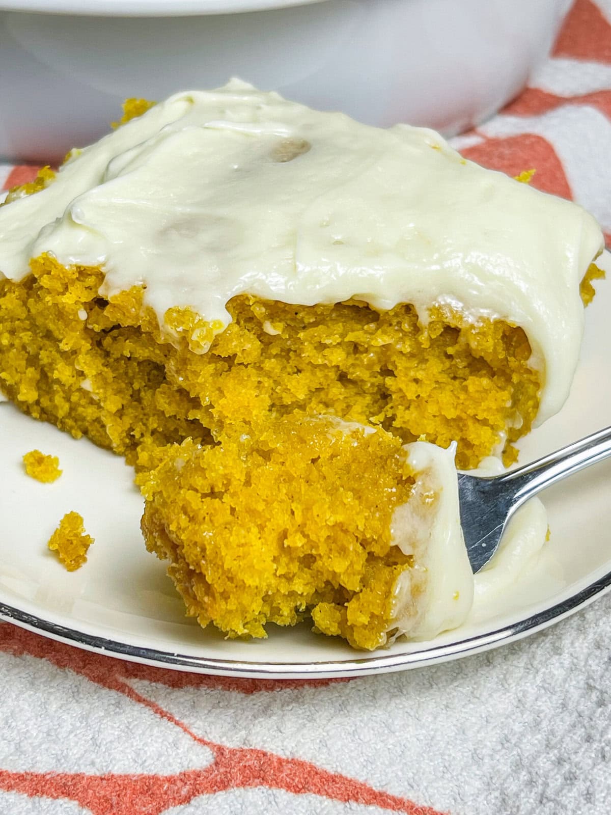 If you love a pumpkin roll, you'll love this Pumpkin Roll Cake! It tastes just like a pumpkin roll but its easier to make and no rolling required!