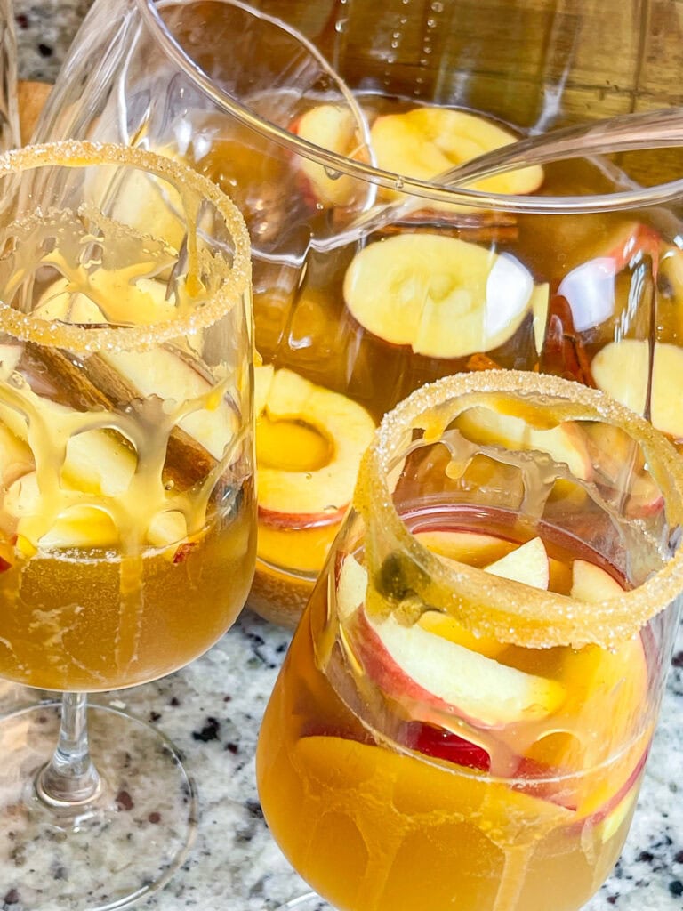 A refreshing autumn cocktail, Sparkling Apple Cider Sangria is made with simple ingredients-prosecco, apple cider, amaretto and club soda. It's a perfect pitcher drink for any occasion.