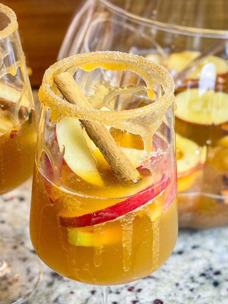 A refreshing autumn cocktail, Sparkling Apple Cider Sangria is made with simple ingredients-prosecco, apple cider, amaretto and club soda.  It's a perfect pitcher drink for any occasion.