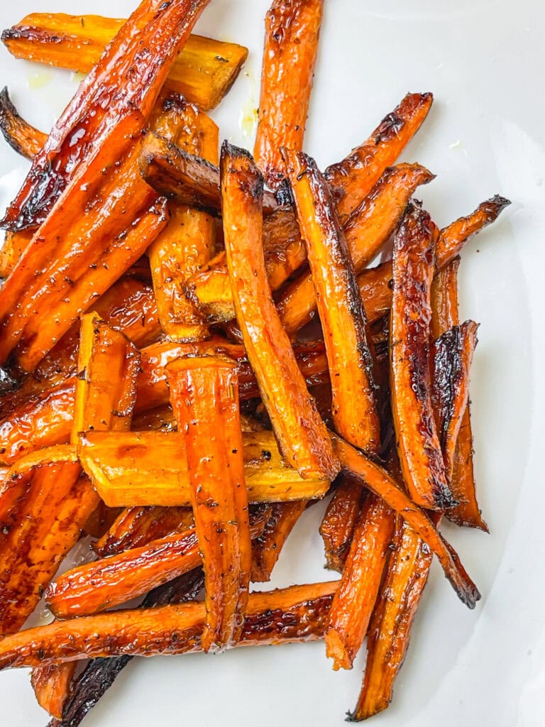 Looking for a simple yet elegant side dish that’s as easy to make as it is delicious? These Sheet Pan Roasted Balsamic Vinegar Honey Glazed Carrots are the perfect answer. Sweet, tangy, and caramelized to perfection, they’re a crowd-pleaser that works for everything from weeknight dinners to holiday feasts. Plus, with just a handful of ingredients and a single sheet pan, cleanup is a breeze. Whether you’re hosting or just treating yourself, these carrots bring bold flavor with minimal effort!