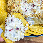 Looking for a crowd-pleasing, festive appetizer for your Thanksgiving table? This adorable Turkey Cheese Ball is not only fun to make but also incredibly delicious. With creamy, tangy layers of cream cheese and white cheddar mixed with savory herbs, walnuts, and a hint of sweet craisins, it’s packed with flavor in every bite. Shaped like a turkey and decorated with a pretzel rod "neck" and candy eyes, this appetizer is sure to be the star of your spread. Paired with pretzel sticks and crackers, it’s the perfect appetizer to kick off your Thanksgiving feast, delighting guests of all ages.