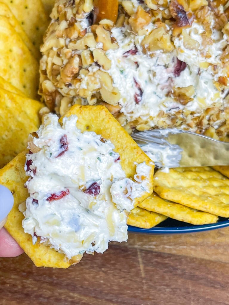 Looking for a crowd-pleasing, festive appetizer for your Thanksgiving table? This adorable Turkey Cheese Ball is not only fun to make but also incredibly delicious. With creamy, tangy layers of cream cheese and white cheddar mixed with savory herbs, walnuts, and a hint of sweet craisins, it’s packed with flavor in every bite. Shaped like a turkey and decorated with a pretzel rod "neck" and candy eyes, this appetizer is sure to be the star of your spread. Paired with pretzel sticks and crackers, it’s the perfect appetizer to kick off your Thanksgiving feast, delighting guests of all ages.