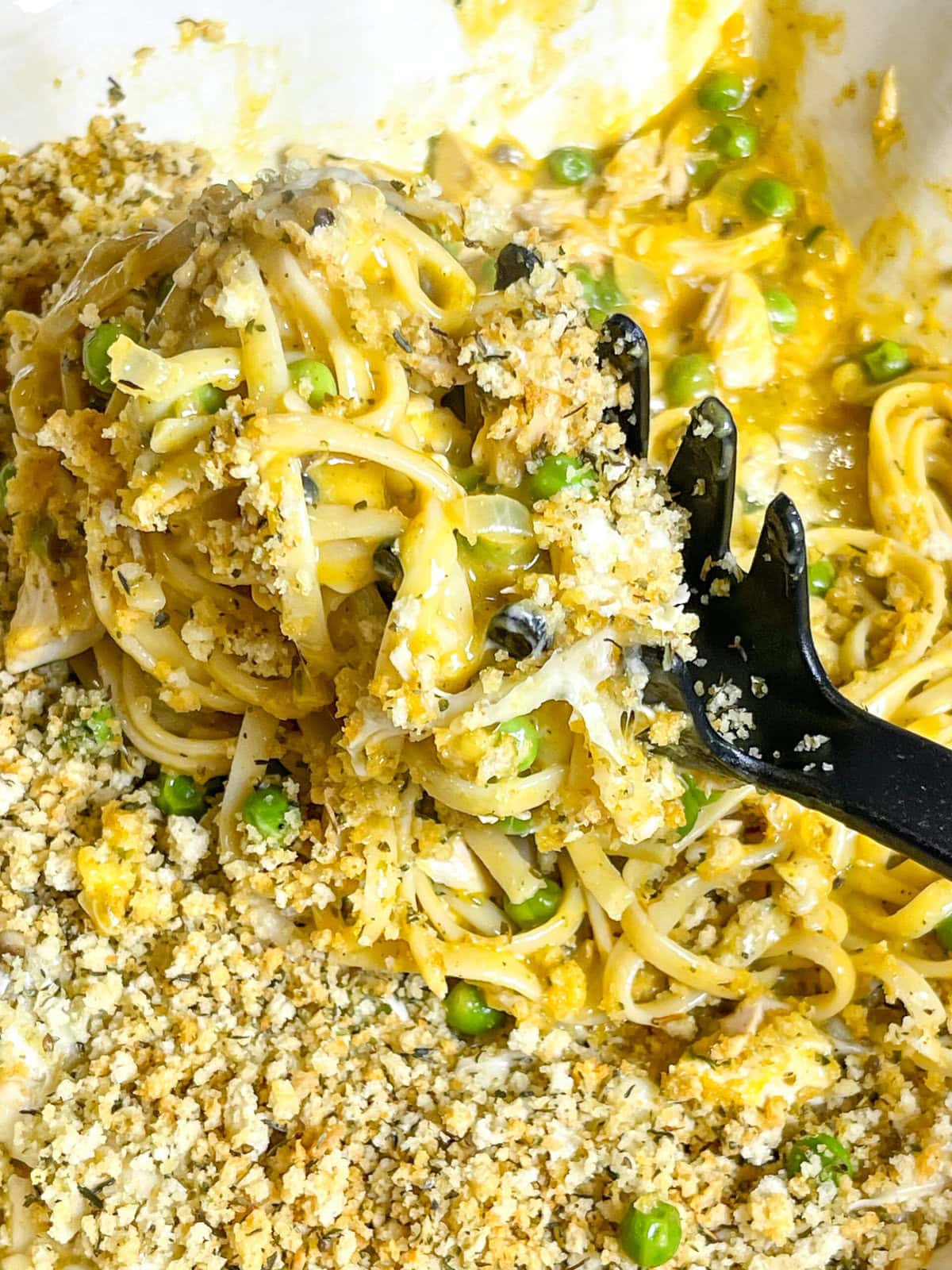 Arguably the leftovers are the best part of Thanksgiving dinner! This easy pasta casserole turns your leftover turkey into a new meal for the day after! Tender turkey is tossed with pasta in a rich, velvety sauce made from cream of mushroom and chicken soups, cheese, and frozen peas and then baked to golden perfection with a crispy breadcrumb topping. The dish is infused with flavors of garlic, onions, mushrooms, and sage for a cozy, satisfying meal. It’s the ultimate way to make the most of your holiday leftovers while delivering a hearty, crowd-pleasing dinner! Serve it with a fresh green salad or steamed veggies for a complete meal. You can make this recipe year round! Just sub the turkey for a shredded rotisserie chicken!