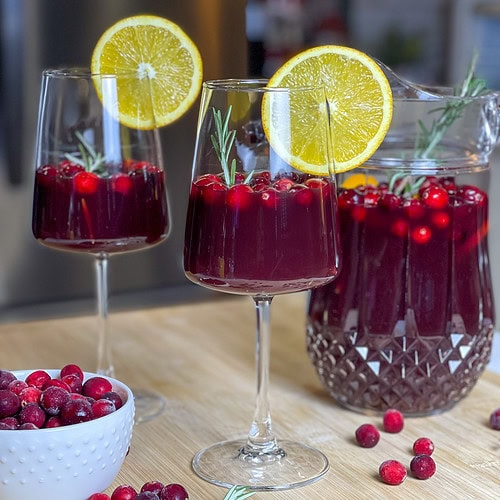 Christmas Sangria is a festive and flavorful holiday cocktail that’s perfect for sharing! Made in a pitcher for easy serving, it combines the rich warmth of red wine with the nutty sweetness of amaretto and the deep fruitiness of blackberry brandy. Orange juice and cranberry juice add a bright, tangy twist, creating a balanced and refreshing drink that’s as vibrant as the season itself. Garnished with fresh cranberries, orange slices, and sprigs of rosemary, this sangria looks as beautiful as it tastes. It’s the ultimate crowd-pleaser for Christmas parties and cozy holiday gatherings!