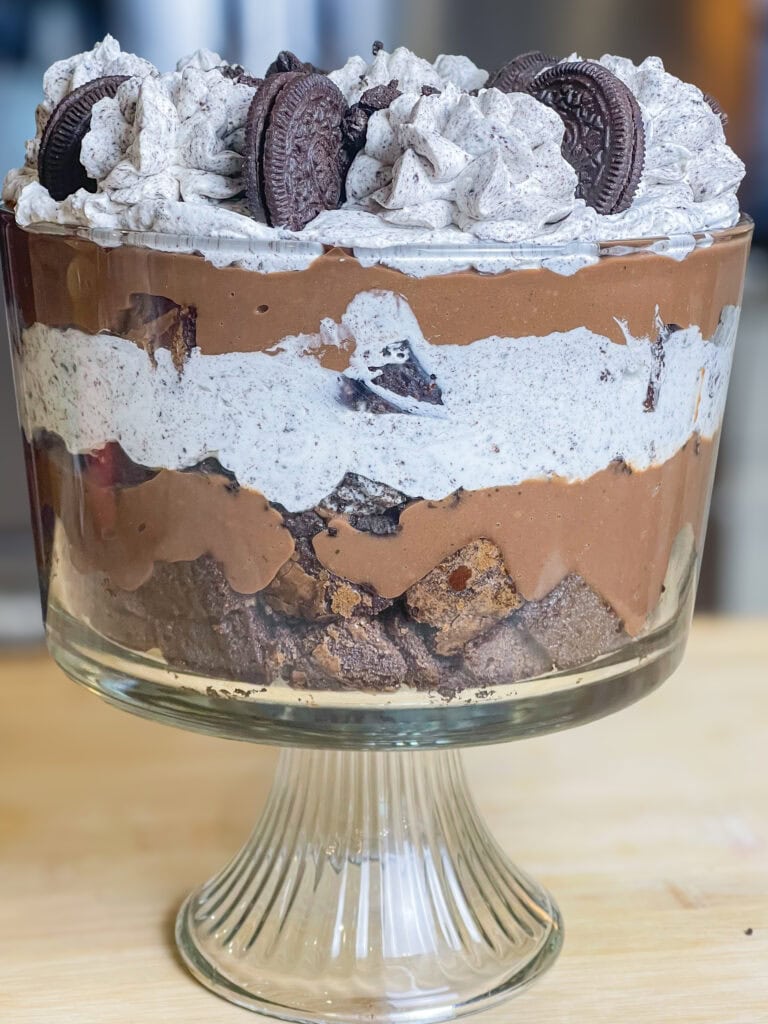 Are you a chocolate lover? I mean, do you really love all things chocolate? If so, this incredibly decadent Chocolate Oreo Brownie Trifle is for you! It's a chocolate lover's dream with a layer of brownies, creamy chocolate pudding, Oreo cookies, all topped off with a homemade Oreo whipped cream. It's divine!