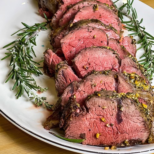 If you are intimidated by cooking a whole beef tenderloin, worry no more! This Easy Beef Tenderloin is seriously so easy, cooked completely in the oven with no searing required. It's the perfect dish to make for any special occasion. Beef tenderloin is the ultimate centerpiece for special occasions, especially during the holidays. While it's undoubtedly a splurge—it is essentially a few pounds of luxurious filet mignon—it’s a dish that delivers unmatched flavor and tenderness, making it worth every penny.