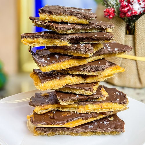 Chocolate Covered Cracker Toffee, often called "Christmas Crack," is an irresistible holiday treat that’s as simple as it is addictive! This sweet-and-salty delight starts with a base of crispy saltine crackers, which are layered on a baking sheet. A rich, buttery caramel sauce is poured over the crackers and baked until bubbly, creating a toffee-like coating that seeps into every nook and cranny.