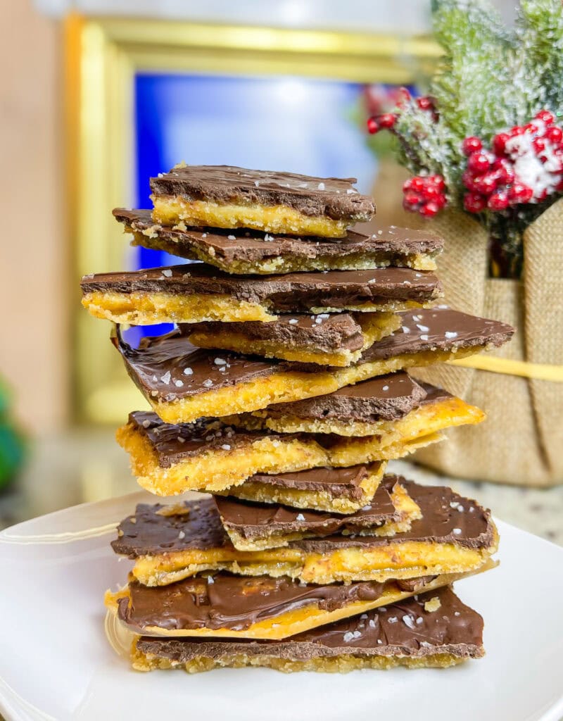 Chocolate Covered Cracker Toffee, often called "Christmas Crack," is an irresistible holiday treat that’s as simple as it is addictive! This sweet-and-salty delight starts with a base of crispy saltine crackers, which are layered on a baking sheet. A rich, buttery caramel sauce is poured over the crackers and baked until bubbly, creating a toffee-like coating that seeps into every nook and cranny.