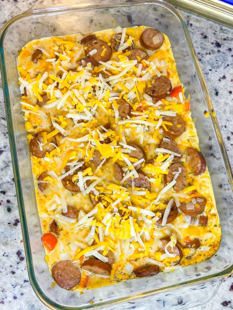 This Andouille Sausage Breakfast Casserole is flavor packed with savory smoked andouille sausage, tender hashbrown potatoes, fluffy eggs, vibrant bell peppers, and gooey melted cheese. Baked to golden perfection, this casserole is the ultimate crowd-pleaser for brunches and holiday mornings!