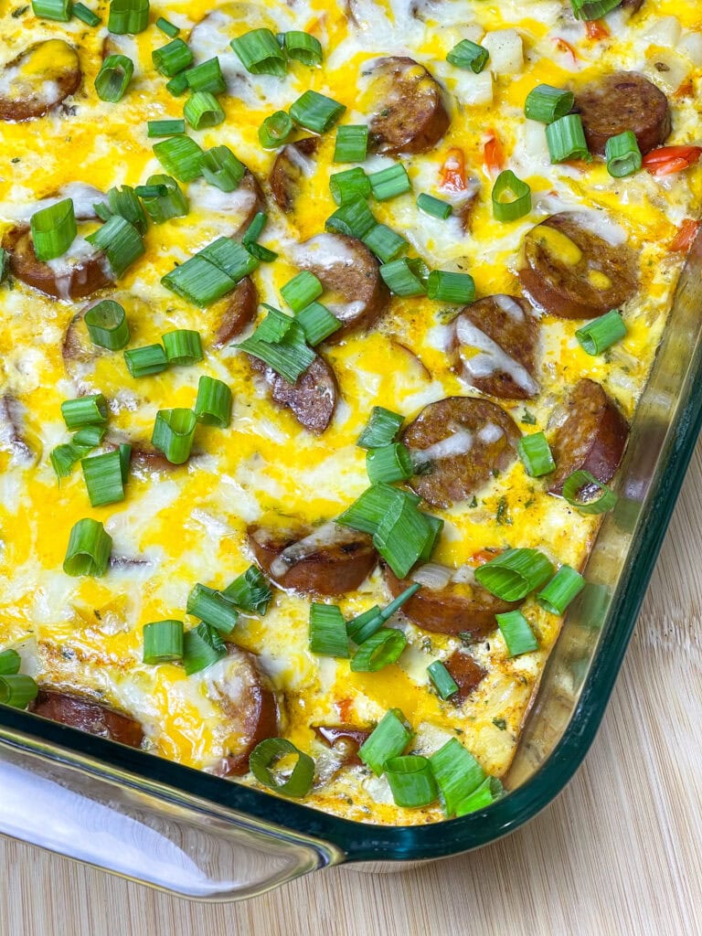 This Andouille Sausage Breakfast Casserole is flavor packed with savory smoked andouille sausage, tender hashbrown potatoes, fluffy eggs, vibrant bell peppers, and gooey melted cheese. Baked to golden perfection, this casserole is the ultimate crowd-pleaser for brunches and holiday mornings!