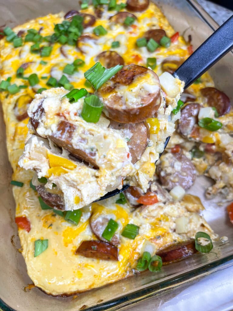 This Andouille Sausage Breakfast Casserole is flavor packed with savory smoked andouille sausage, tender hashbrown potatoes, fluffy eggs, vibrant bell peppers, and gooey melted cheese. Baked to golden perfection, this casserole is the ultimate crowd-pleaser for brunches and holiday mornings!