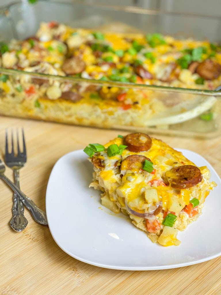 This Andouille Sausage Breakfast Casserole is flavor packed with savory smoked andouille sausage, tender hashbrown potatoes, fluffy eggs, vibrant bell peppers, and gooey melted cheese. Baked to golden perfection, this casserole is the ultimate crowd-pleaser for brunches and holiday mornings!