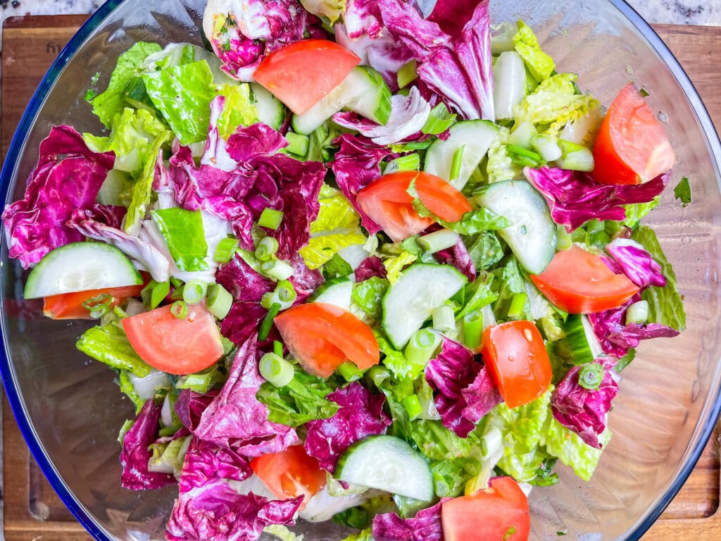 This simple Salad with Lemon Garlic Vinaigrette is the perfect accompaniment to any dish or base to add your favorite protein for a flavorful and balanced meal. I love a simple and fresh salad and this one is so easy! You probably already have the ingredients on hand in your pantry for the vinaigrette.