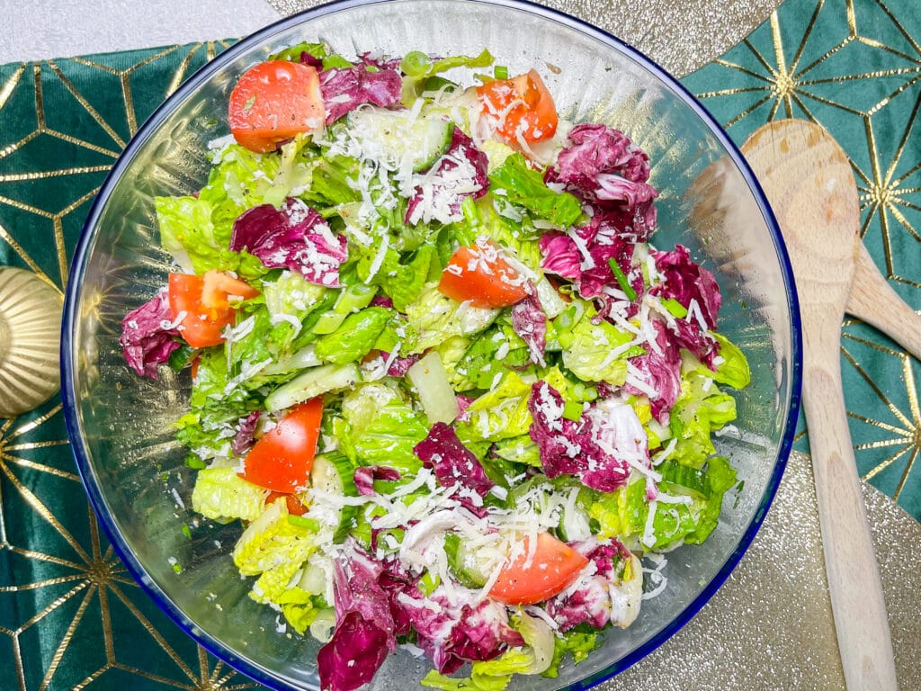 This simple Salad with Lemon Garlic Vinaigrette is the perfect accompaniment to any dish or base to add your favorite protein for a flavorful and balanced meal. I love a simple and fresh salad and this one is so easy! You probably already have the ingredients on hand in your pantry for the vinaigrette.