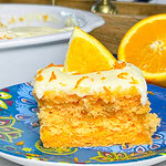 Orange Creamsicle Poke Cake tastes just like the ice cream treat you remember- a bright orange tang along with a creamy vanilla finish. This cake starts with an orange boxed cake mix, studded with creamy orange Jell-o and finished with a citrus orange cream cheese frosting. You'll want to start bringing this dessert everywhere!