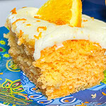 Orange Creamsicle Poke Cake tastes just like the ice cream treat you remember- a bright orange tang along with a creamy vanilla finish. This cake starts with an orange boxed cake mix, studded with creamy orange Jell-o and finished with a citrus orange cream cheese frosting. You'll want to start bringing this dessert everywhere!